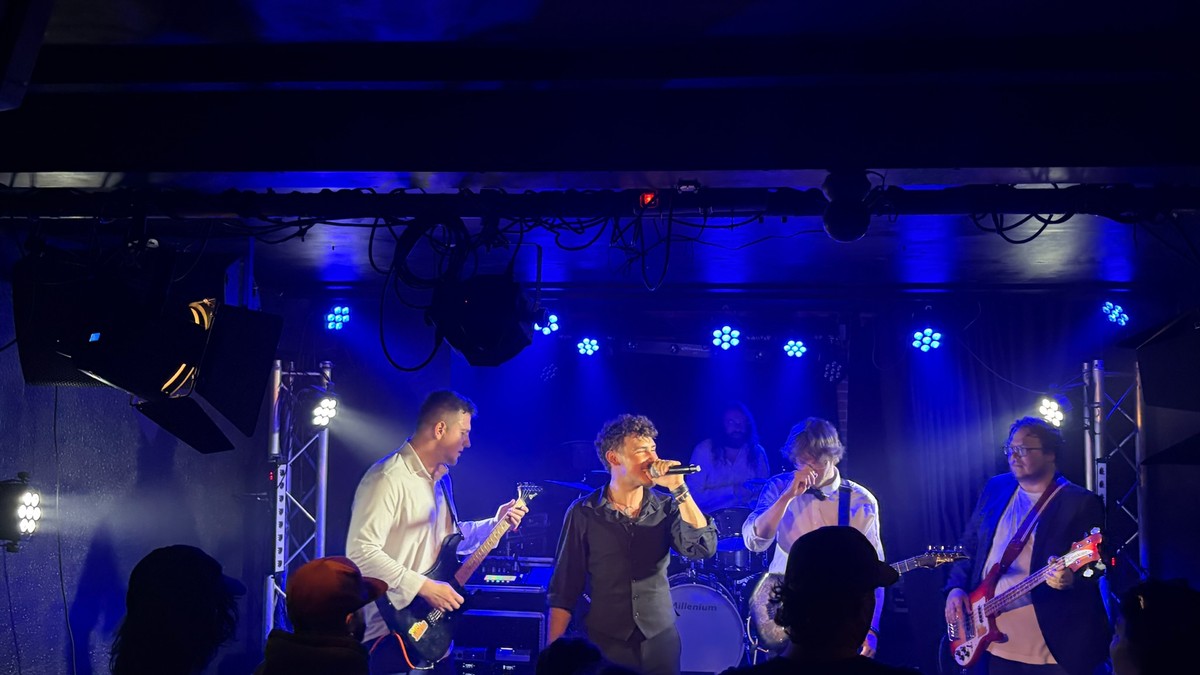A live band performing on a club stage